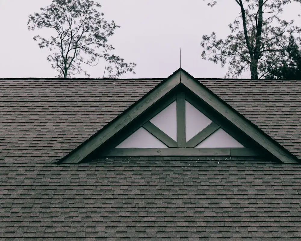 Anthracite grey roofline and bargeboards on the gable end of a UK home