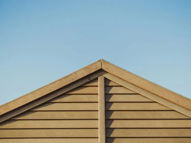Timber-effect exterior cladding on the wall of a UK property