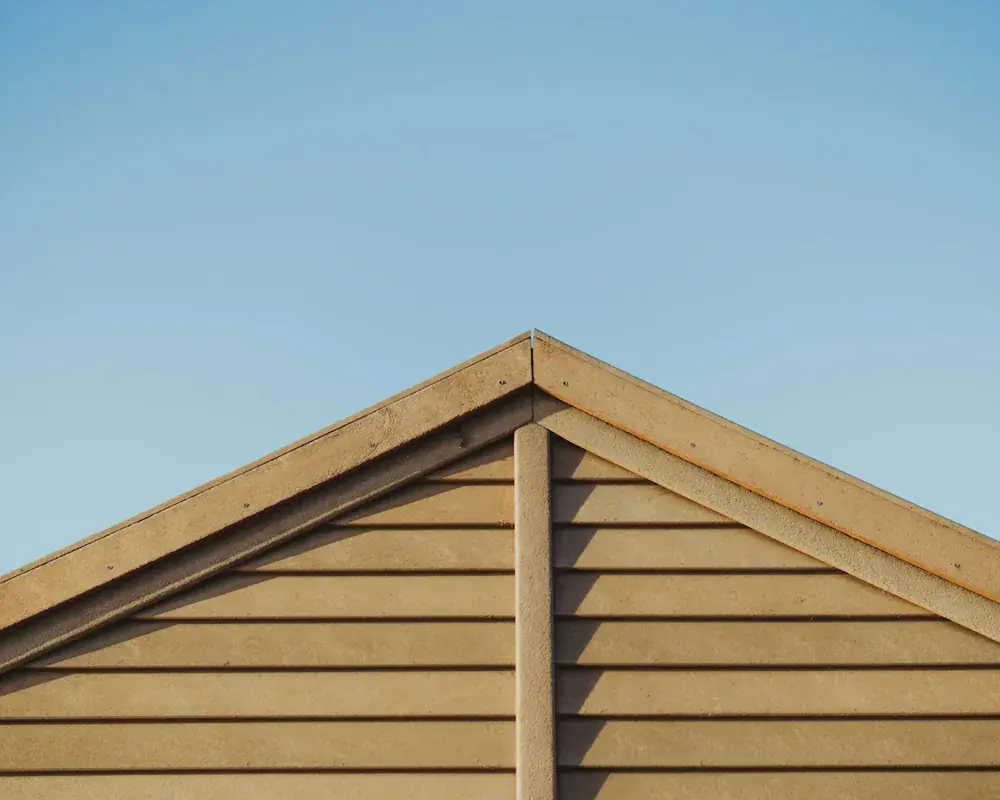 Timber-effect exterior cladding on the wall of a UK property