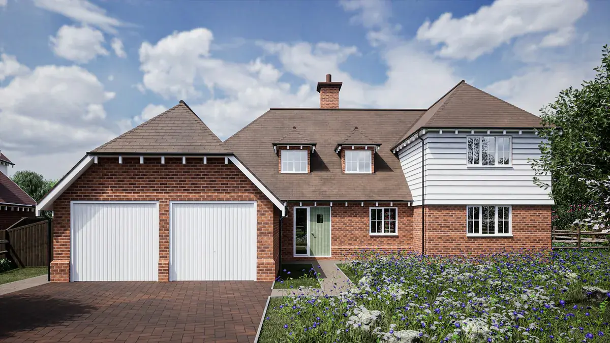 Detached UK brick house with white fascias, soffits and guttering