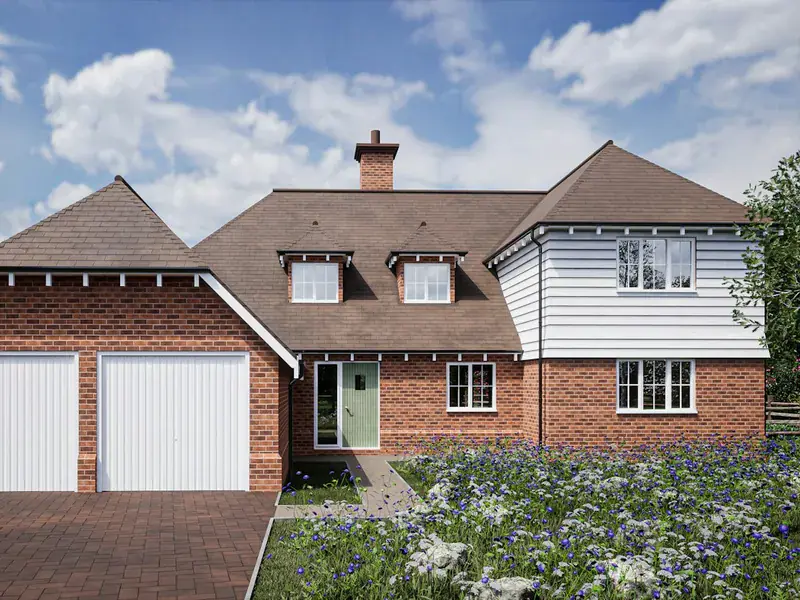 Detached UK brick house with white fascias, soffits and guttering