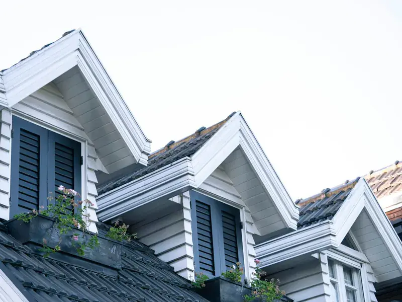UK home with dormer windows and crisp white rooflines