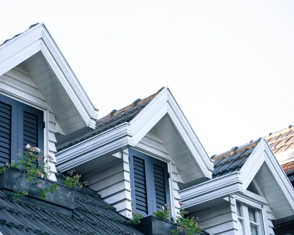 UK home with dormer windows and crisp white rooflines