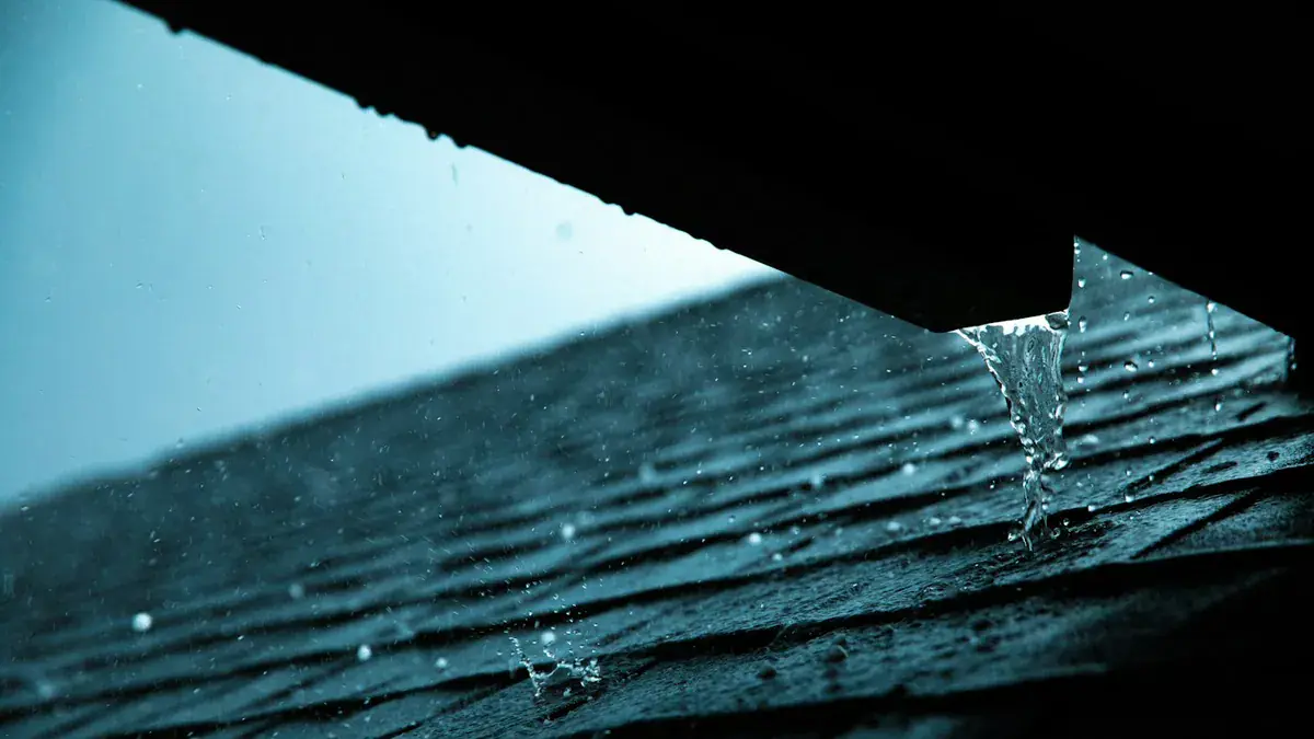 uPVC rainwater guttering fixed along a tiled roof edge on a UK home