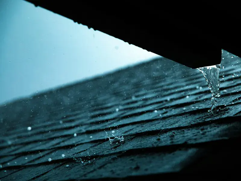 uPVC rainwater guttering fixed along a tiled roof edge on a UK home