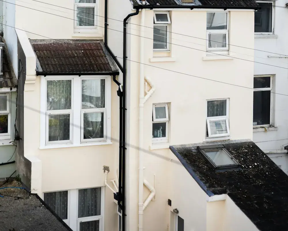White semi-detached UK houses with neat white rooflines