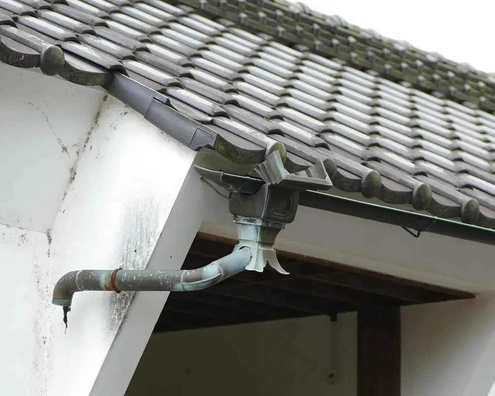White uPVC fascia boards and guttering along the roof edge of a UK home